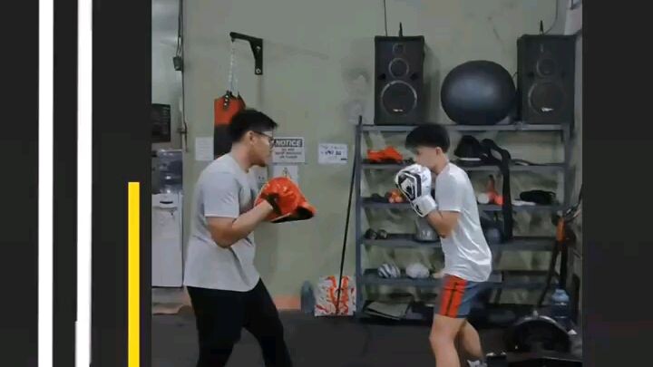intermediate boxing student doing uppercut