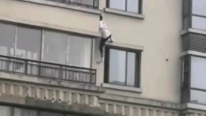 The young man climbed down from a tall building, he is a special forces soldier