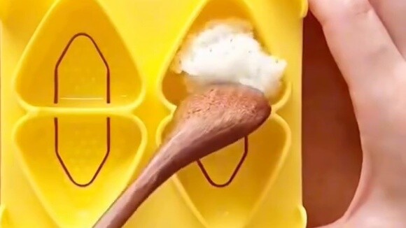 A Korean mother prepares a lunch box for her child, which takes an hour to prepare and is eaten in l