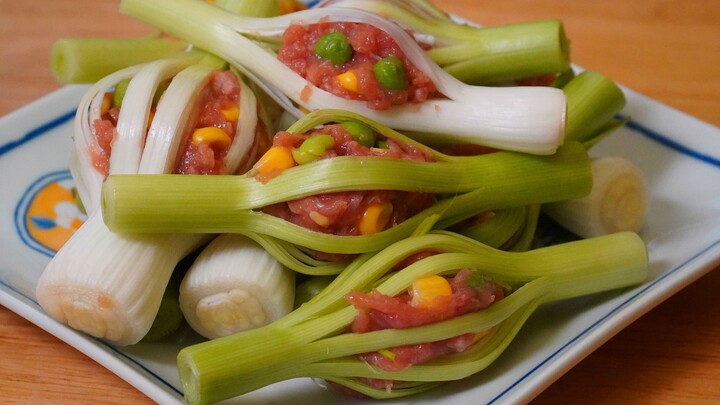 Stuff pork into garlic sprouts—once it’s out of the pan, you’ve got a nearly lost culinary treasure.