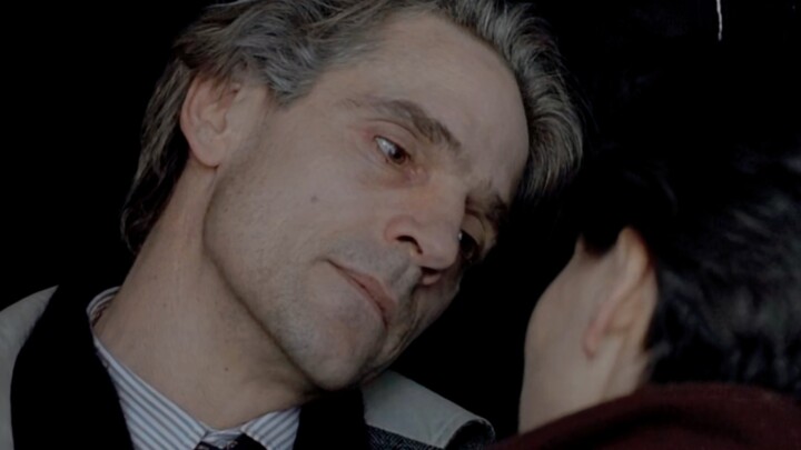 “In his eyes, a thousand words linger, yet his lips remain silently sealed.”