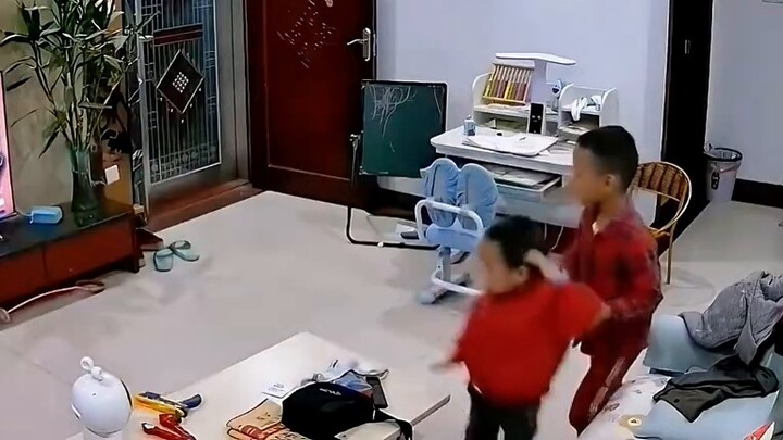 A collection of precious images of a naughty child smashing a TV