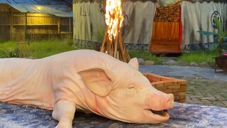Homemade grill, simple grilling a 200-pound pig
