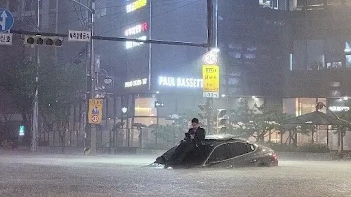 The calmest fanboy in the Korean rainstorm...