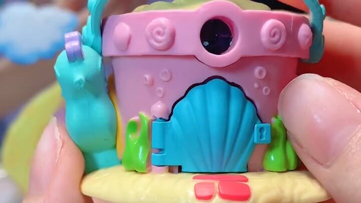 A miniature house similar to Polly Pocket