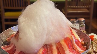 Sukiyaki pot topped with marshmallows? It's weird and kind of delicious, and the waiter feeds you?