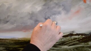 A 70-year-old British uses a roll of paper and brushes to draw details
