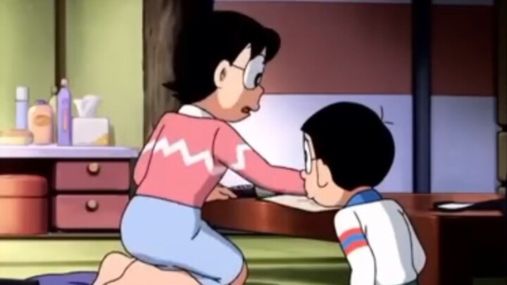 ibu sedang menasihati nobita