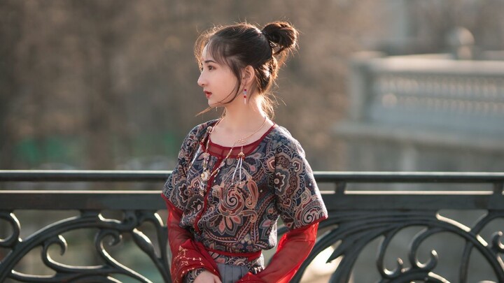 Russian girl wearing Chinese costume dances ballet in front of the Bolshoi Theatre in Moscow, Russia