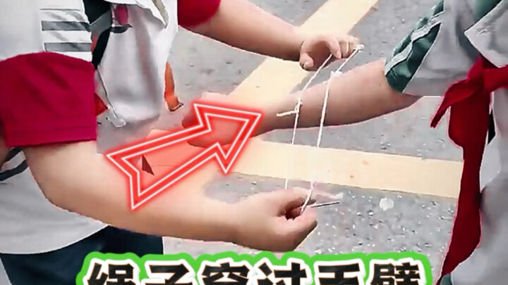 A little magic trick: pass a rope through your arm—learn it and show it off to your friends!