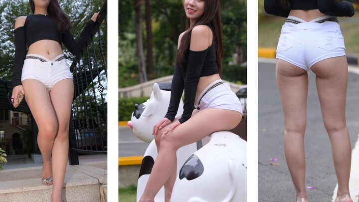 Quần short trắng, giày cao gót trong suốt, áo dài tay hở rốn