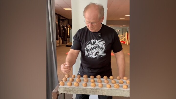 A 66-year-old man, known as "Mr. Hammerhand," set a new Guinness World Record by cracking 293 walnut