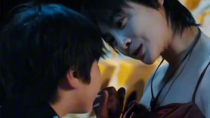 The assassin and the little boy fight over food, only to discover the boy’s feet are shackled with i