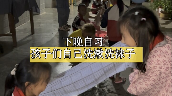 After evening self-study, the kids grab their basins to fetch water for washing up. At such a young 