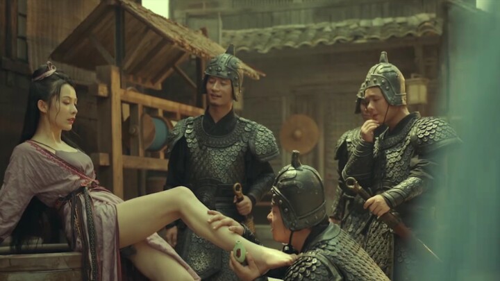 The beautiful girl had a sore foot, so four soldiers treated her.