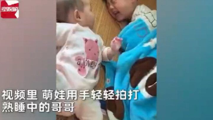 Cute kid tries to wake up big brother, but gets frozen in fear by his morning grumpiness! Adorable m