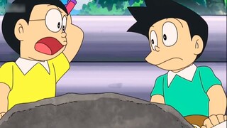 Doremon Nobita biến mình và chồng thành đá