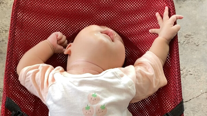 At four and a half months old, the human baby has finally discovered its own hands and is beginning 