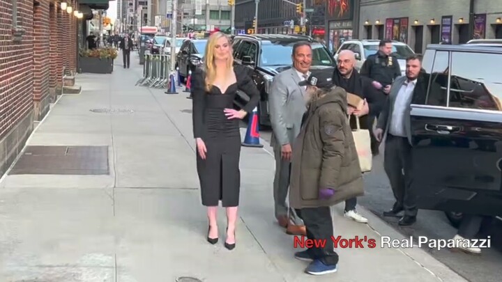 Elle Fanning pose next to Radioman outside The Late Show With Stephen Colbert.