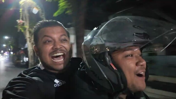 Salaryman racing scooters in Bali, Indonesia