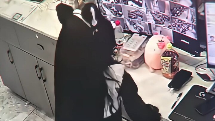 You thought she was watching the surveillance footage! Actually, it was him watching the surveillanc