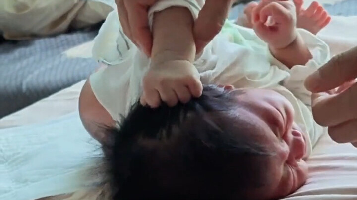 Is vigorously pulling one’s hair until crying a universal trait of human kids?