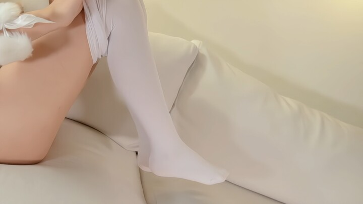 Young lady takes off her white stockings