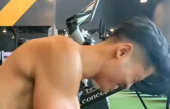 Handsome guy relaxes his muscles after a workout