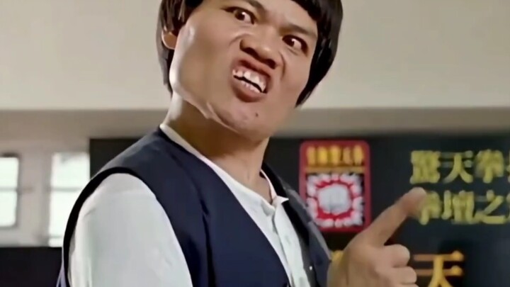 I'll choose the short guy sweeping over there.