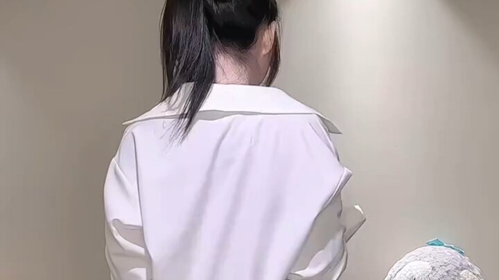 A white shirt can’t hide her graceful figure.