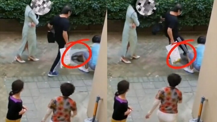 Young woman feeding stray cats sparks outrage; elderly lady kicks the cat away with a violent kick a