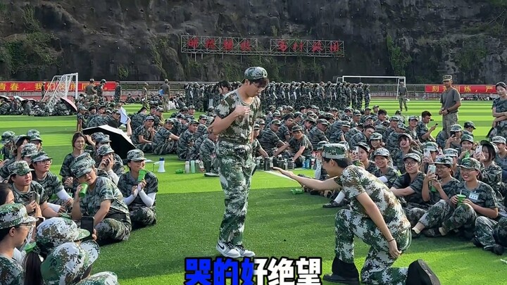 Performing an awkward dance for everyone during military training