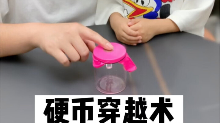 Parent-child magic trick: A coin passes right through a balloon and instantly lands in a glass!