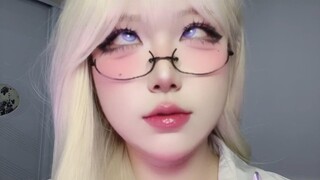 The white-haired one rolls their eyes and pulls funny faces to attract good luck