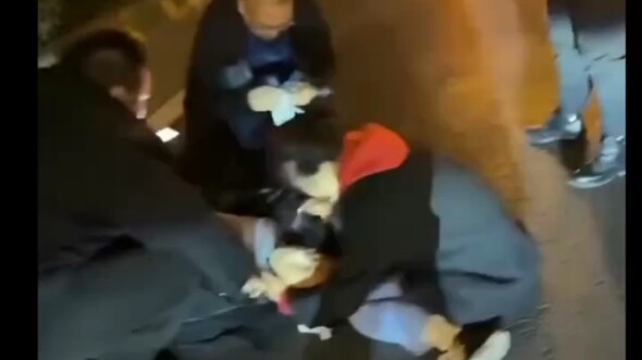 Young man in a car accident falls into a coma; bystander administers first aid with an AED.