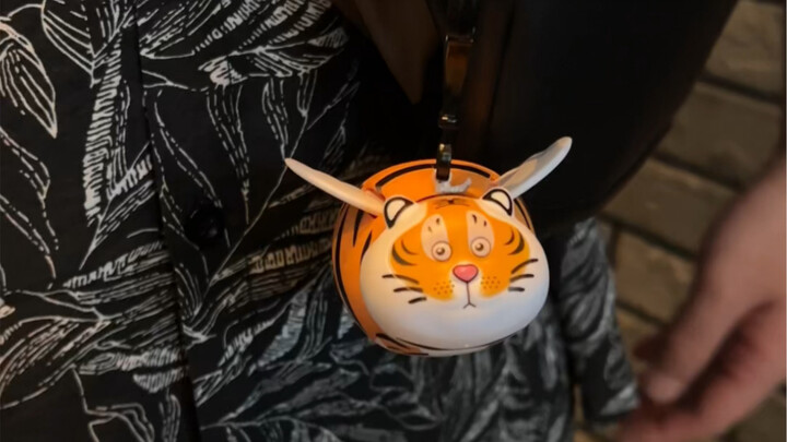 My boyfriend gave me this little trinket, saying it symbolizes "adding wings to a tiger" and "leapin