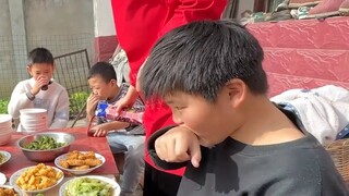The whole village had a feast and I sat at the table with the children