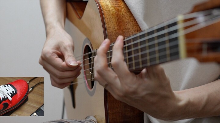 Saya menggabungkan gitar klasik dengan pedal wah.