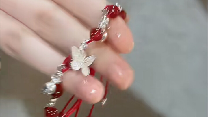 A stunning touch of red for spring and summer! The red agate, silver flakes, and butterfly design ar