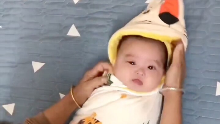 Grandma's childcare tip: Use a swaddling bag to help baby practice rolling over!