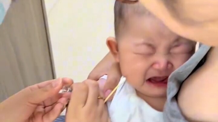 Young mom takes her child for an injection