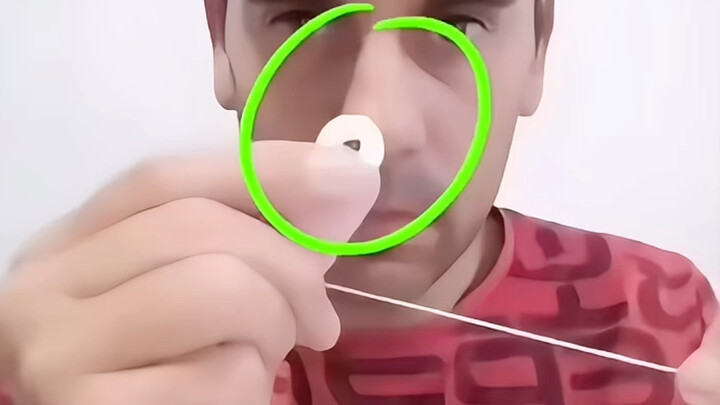 Unveiling Folk Deceptions: The Ring Candy Passes Through the Rubber Band!