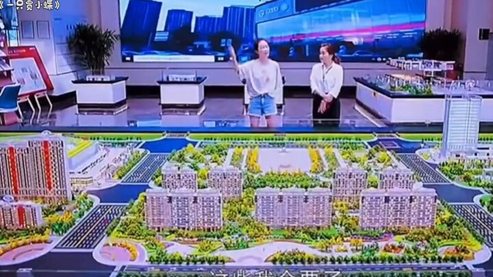 Beauty wields a time-travel camera, goes back in time to buy lottery tickets, and wins the whole apa